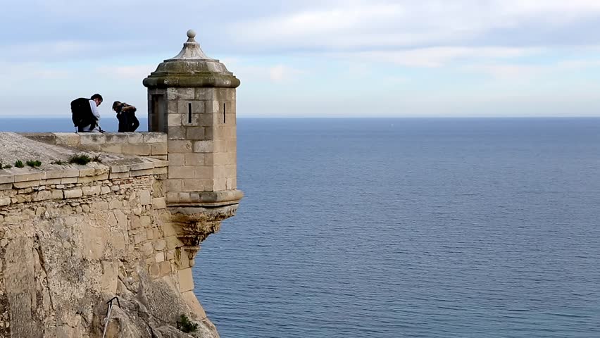 Spain Alacant
Man and woman are standing on the watchtower of the castle