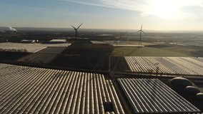AERIAL: Shadow of a wind generator in the morning in germany. 4K Aerial video