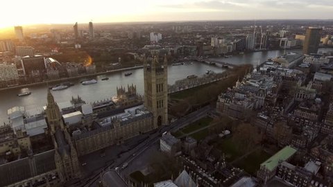 Aerial View Flying Over Big Ben in London feat British Flag and Sunshine 4K