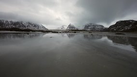 Movement of water on the shores of cold Norwegian Sea at evening time. Lofoten islands. Beautiful Norway landscape. HD Footage.