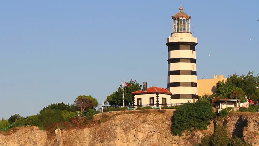 Sile lighthouse. Tilt from hill to the sea surface
