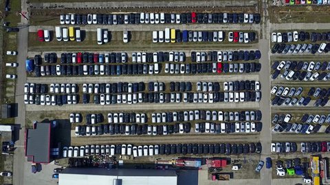 Aerial shot of new cars and trucks parking, top view. 4K video
