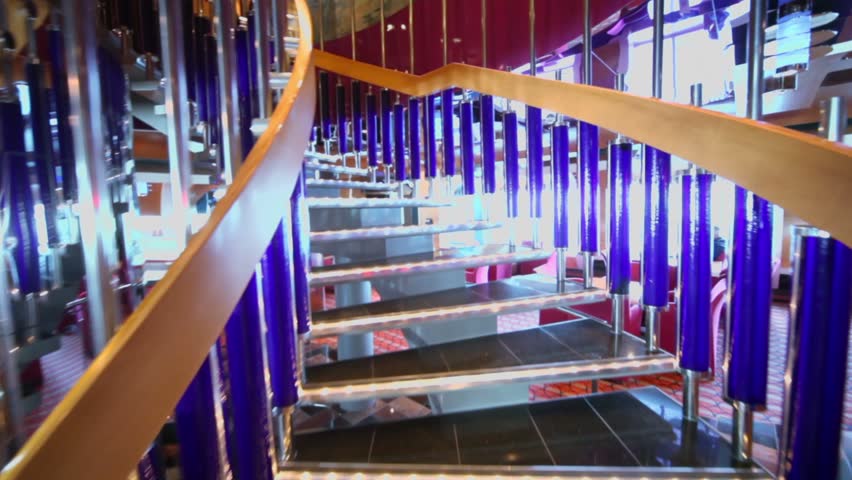 Upward motion by spiral staircase in restaurant on ship during cruise