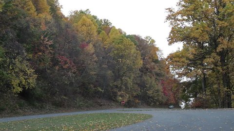 Roanoke, USA - October 27: An SUV car drives on the Blue Ridge parkway in Virginia, USA. The Blue Ridge Parkway is a famous mountain highway in Virginia and North Carolina.