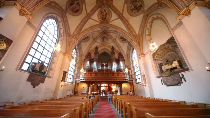 Tourists walk inside Klara kyrka church in Stockholm