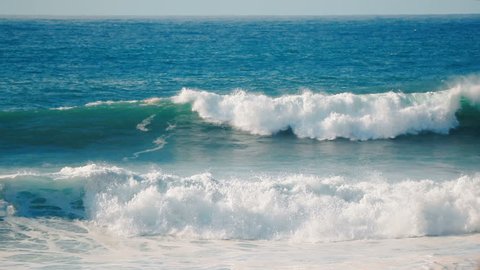 Full HD 1920x1080, 120 FPS to 23.98 slow motion close up video background of blue, turquoise water of big rough ocean surfing waves splashing and crashing tropical Hawaii beach, moving towards camera