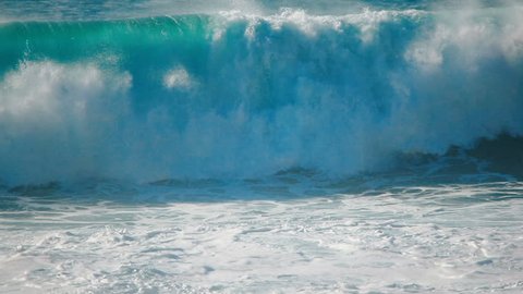 Ocean surf waves slow motion of blue sea water spraying, splashing, breaking, crashing Hawaii tropical beach coast. Big, extreme, giant, huge, large barrels crushing, as liquid nature power background