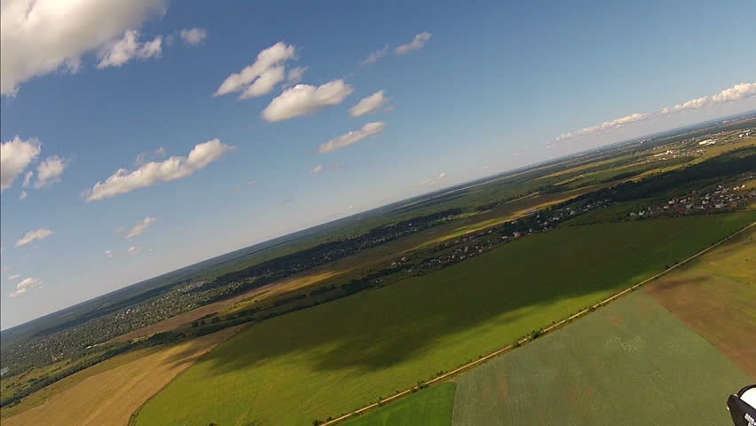 Flying over the Countryside, Bird's-eye. Extreme camera  is mounted on the wing