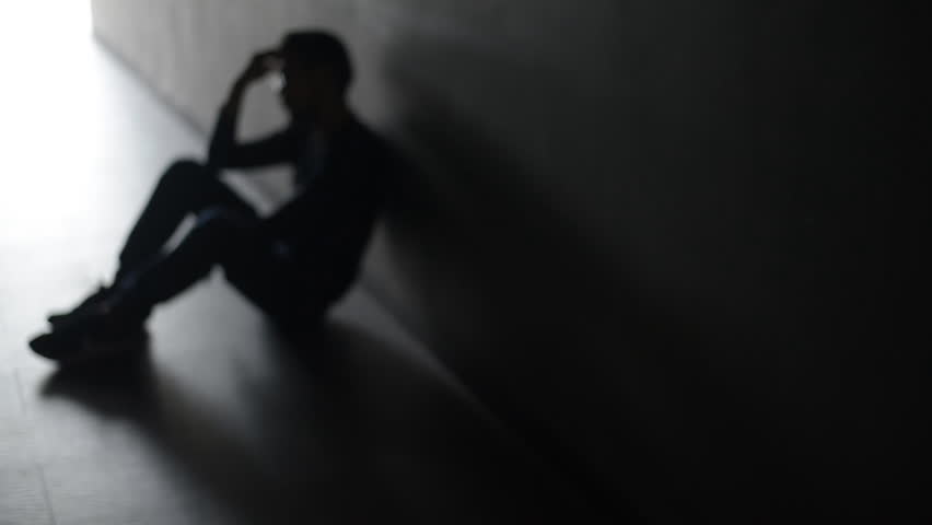Asian troubled man in an empty room is hopeless. Blurred and silhouette shot. Royalty-Free Stock Footage #25578725