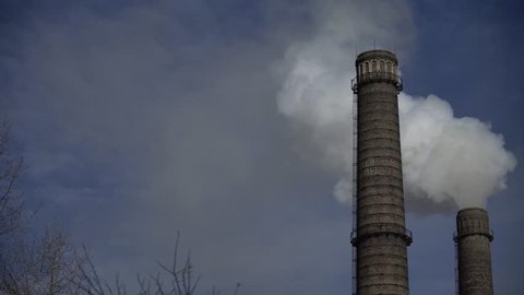 The smoke from the chimneys in the factory