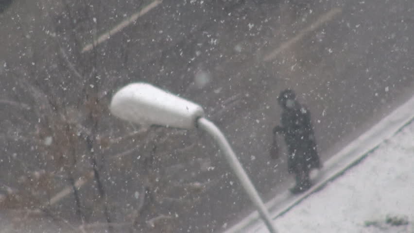 Snow falling and traffic car