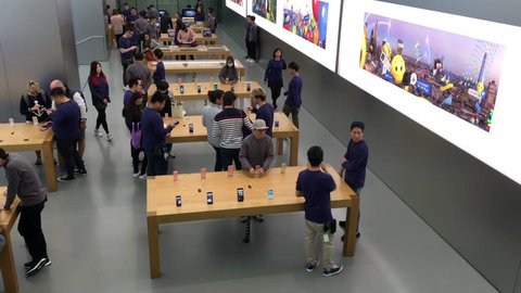 HONG KONG, CHINA - MARCH 16, 2017: People inside the Apple Store at Genius Bar. As of 2014, Apple employs 72,800 permanent full-time employees, maintains 437 retail stores in fifteen countries. 