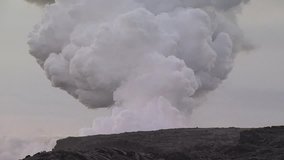 Volcanic Steam Cloud Rises From Behind Cooled Molten Lava Coast Line - Powered by Shutterstock - Get 15% off with code: PIKWIZARD15