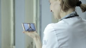 On-line medical consultations. male patient video chatting with doctor on phone