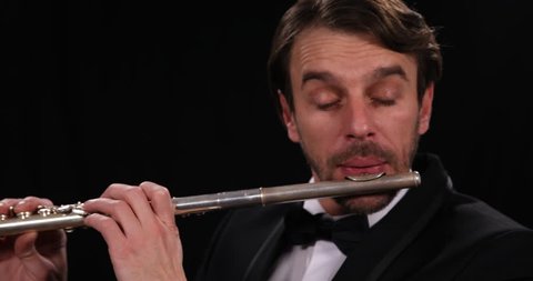 Closeup Shot Portrait of Flutist Musician Play Flute Instrument Orchestral Music
