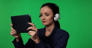 Woman Holding Digital Tablet Watching Movie Headphones Green Screen Background