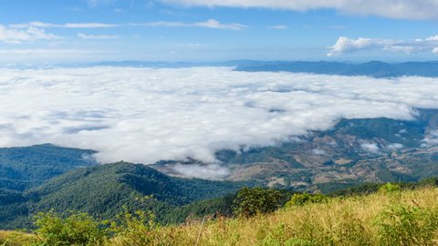 Time lapse -Morning fog in dense tropical rainforest, Misty mountain forest fog at Kew Mae Pan View in Doi Inthanon national park of chiang mai, thailand (pan shot)