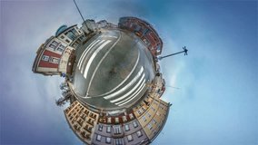 Tiny Little Planet 360 Degree Timelapse. Opole Downtown, Old Cityscape Nearby Trade Center. City Transportation, Road Marking, Traffic. Sidewalk is Cobblesone. Spherical Panorama of Opole Sights,