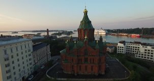 Aerial view drone footage of Helsinki Baltic Sea lagoon area, city skyline with vintage architecture and boats in summer evening, the capital of Finland Suomi, northern Europe