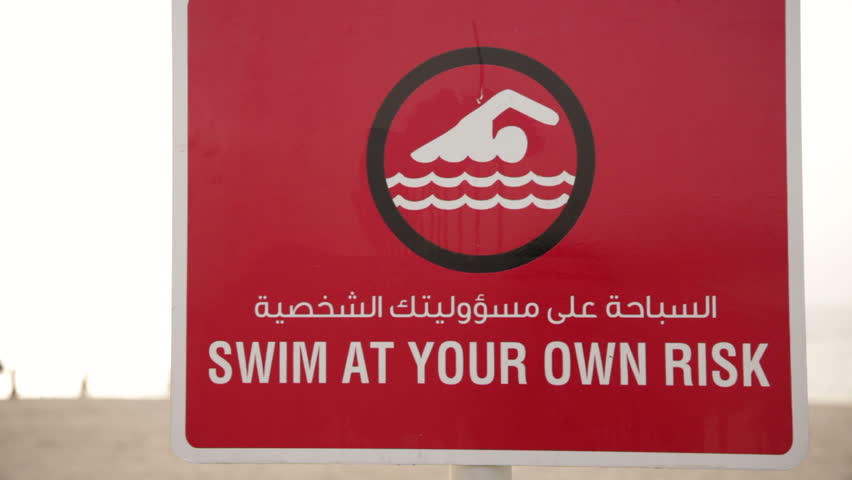 Swim at Your Own Risk signal in Arabic.