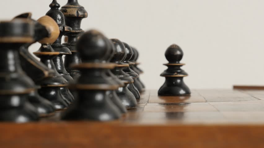 Old chess set figures arranged on game playing table 4K 2160p 30fps UltraHD footage - Blac player pawn moving over chequered fields 3840X2160 UHD video