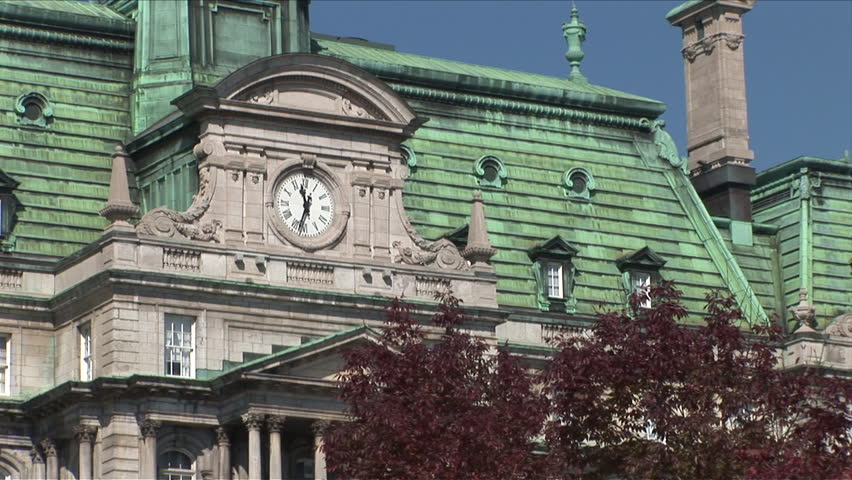 Montreal, Canada - CIRCA October 2007: Zoom out of the clock tower on the Montreal City Hall building as seen during the day