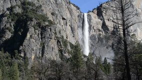 Yosemite Falls in Spring, swollen with snowmelt, combined with granite peaks and green valleys make for an idyllic setting despite global warming concerns, Yosemite National Park, California