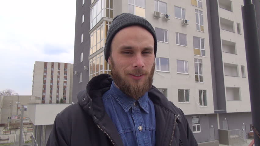 Portrait of happy young man in the city