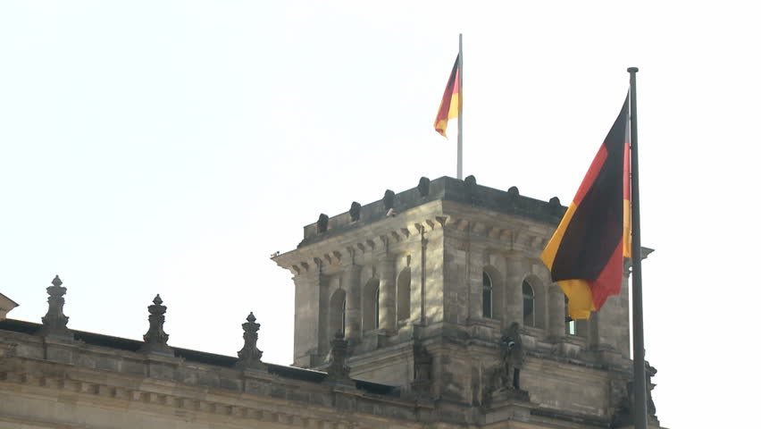 German Reichstag in Berlin with german flag