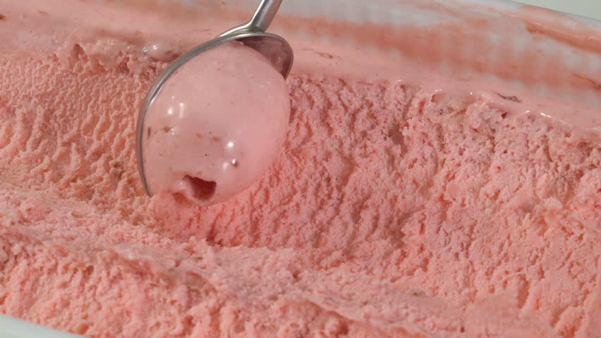 Strawberry ice cream scooping out of container | Shutterstock HD Video #25654163