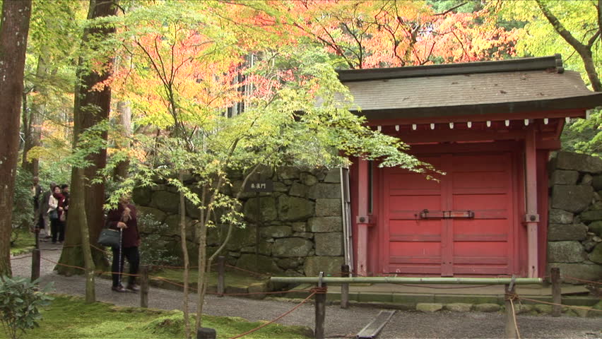 Kyoto, Japan - CIRCA November, 2006: A classically designed Japanese Buddhist temple in a forest during the day