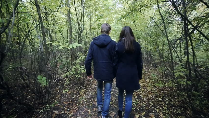 Young Couple Man and Woman Hugging in Love Romantic Outdoor with forest nature on background Fashion trendy style 