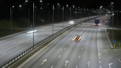 Long Exposure Time Lapse of Western Bypass Night Traffic in Vilnius, Lithuania. High-angle view from a bridge.
