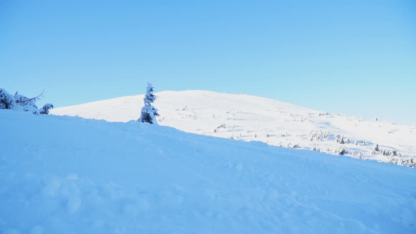Snowboarders rest on the mountainside in the Carpathians, Go Everywhere