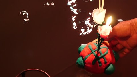 Floating Krathongs used to celebrate during Loy Krathong Festival in Thailand. Some of them are made of bread. It is used to show respect to the Goddess of water.  Stock Video