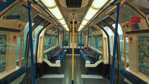 LONDON, April 2017 - Stress-free commuting - An ultra-wide angle symmetrical shot showing an empty carriage of the London Underground tube train