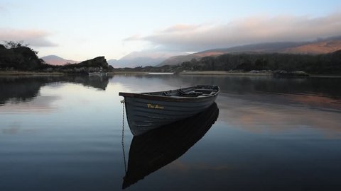 Killarney National Park in Kerry, Ireland / Lake boat/  Morning at Killarney lake with moutains in background, Ireland