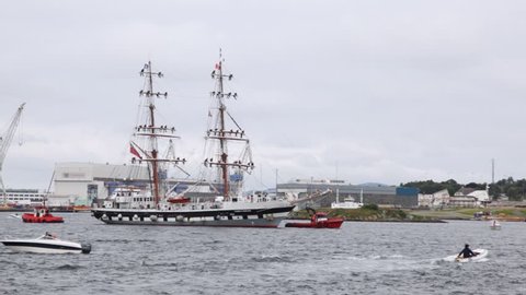 STAVANGER - JUL 28: Tows accompany sailing vessel Stavros S Niarchos in harbor on festival-regatta Tall Ships Races, on July 28, 2011 in Stavanger, Norway