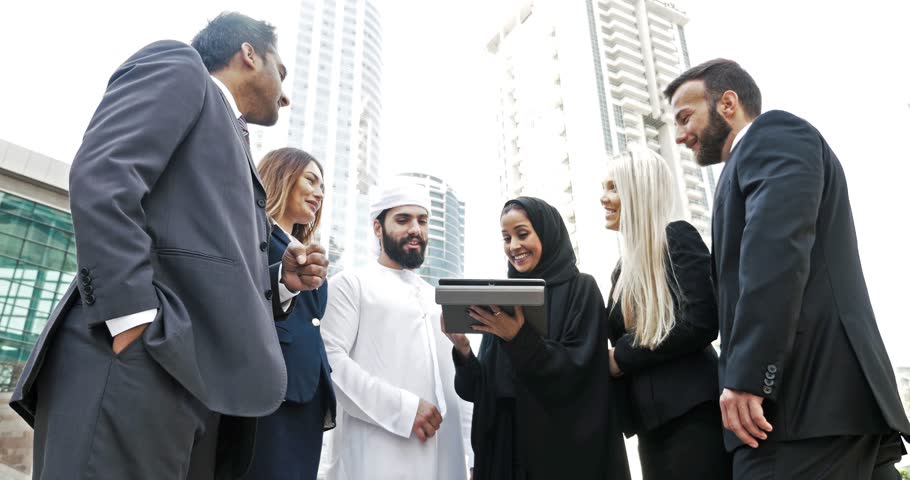 Arabian and western business people talking about business