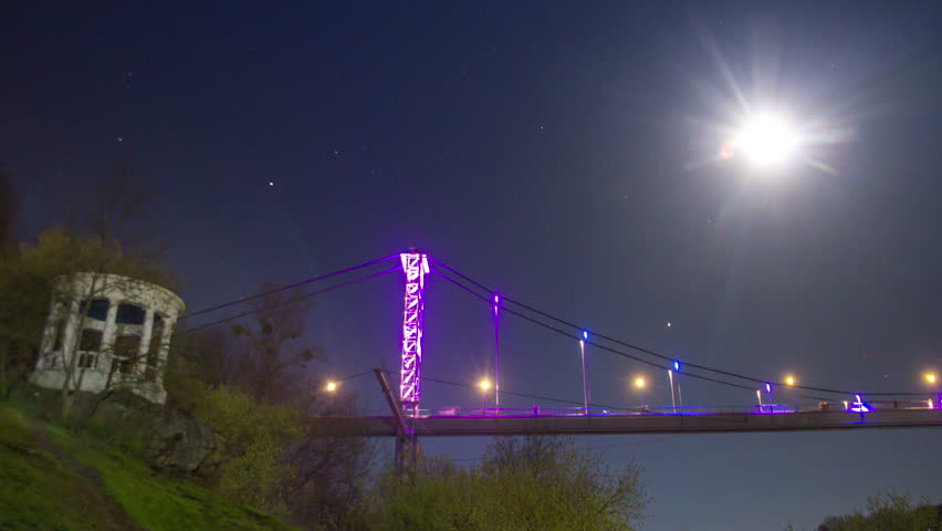 Alcove in the night on bridge neon background. Time lapse