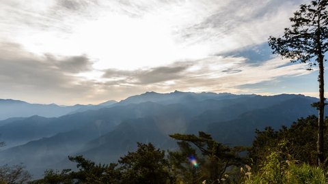 Time lapse of Alishan Mountains National Park Scenic Sunrise with mist and cloud of sea Landscape at Taiwan (zoom shot)