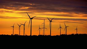 High quality video of windmills at the sunset in 4K