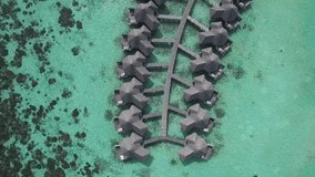 4k aerial video, bird eye view, drone fly over the Maldives islands. Small tropical island. Islands in the ocean. Palm. Ocean. Sky. White sand. Beach. Waves. Island. Islands. Tropics.