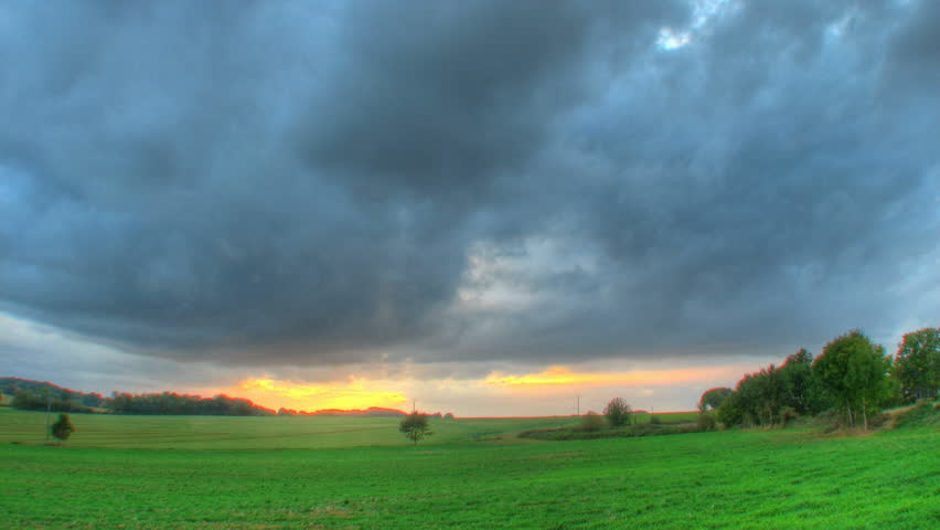 Sunset over fields time lapse, high dynamic range imaging 