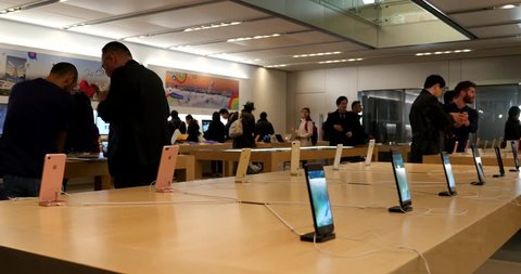 TOKYO, JAPAN - CIRCA MARCH, 2017: Customers inside Apple Store. Apple Inc. is an American multinational technology company headquartered in Cupertino, California. 