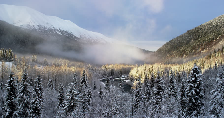 Time lapse of fog in an Alaskan Valley at sunset..