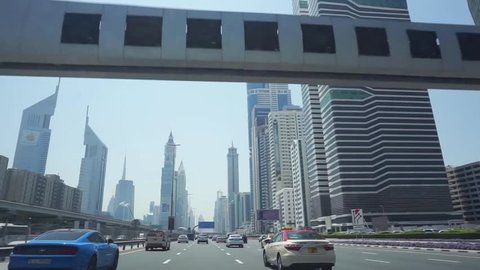 DUBAI, UAE - 01 APRIL 2017 :  Driving on SHEIKH ZAYED ROAD, A high number of tall towers on both side is very impressive. Apart from that Dubai Water Canal is set and officially open now. 
