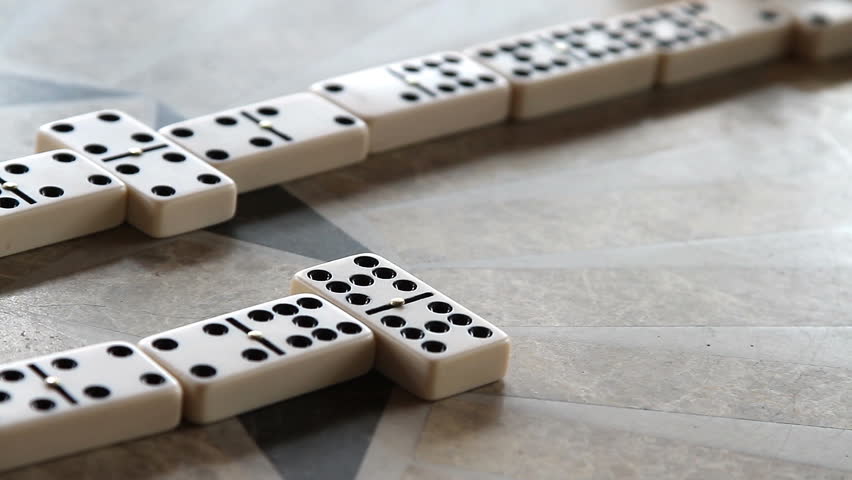 a friendly game of dominoes at an elderly home, nursing home.