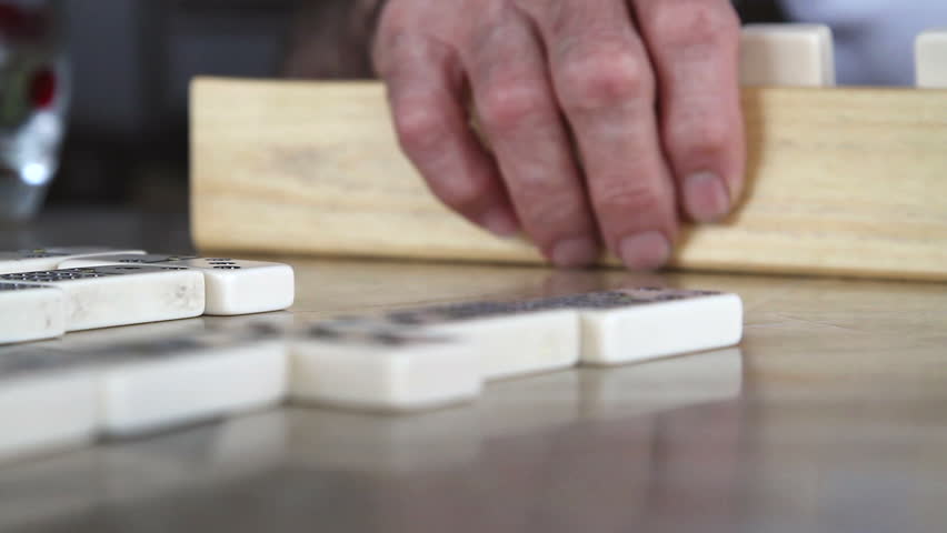 a friendly game of dominoes at an elderly home, nursing home.