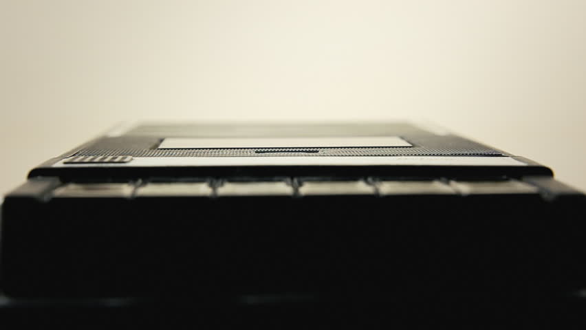 Inserting an audio cassette into a vintage player. Low POV macro close-up shot.
 Royalty-Free Stock Footage #25769753